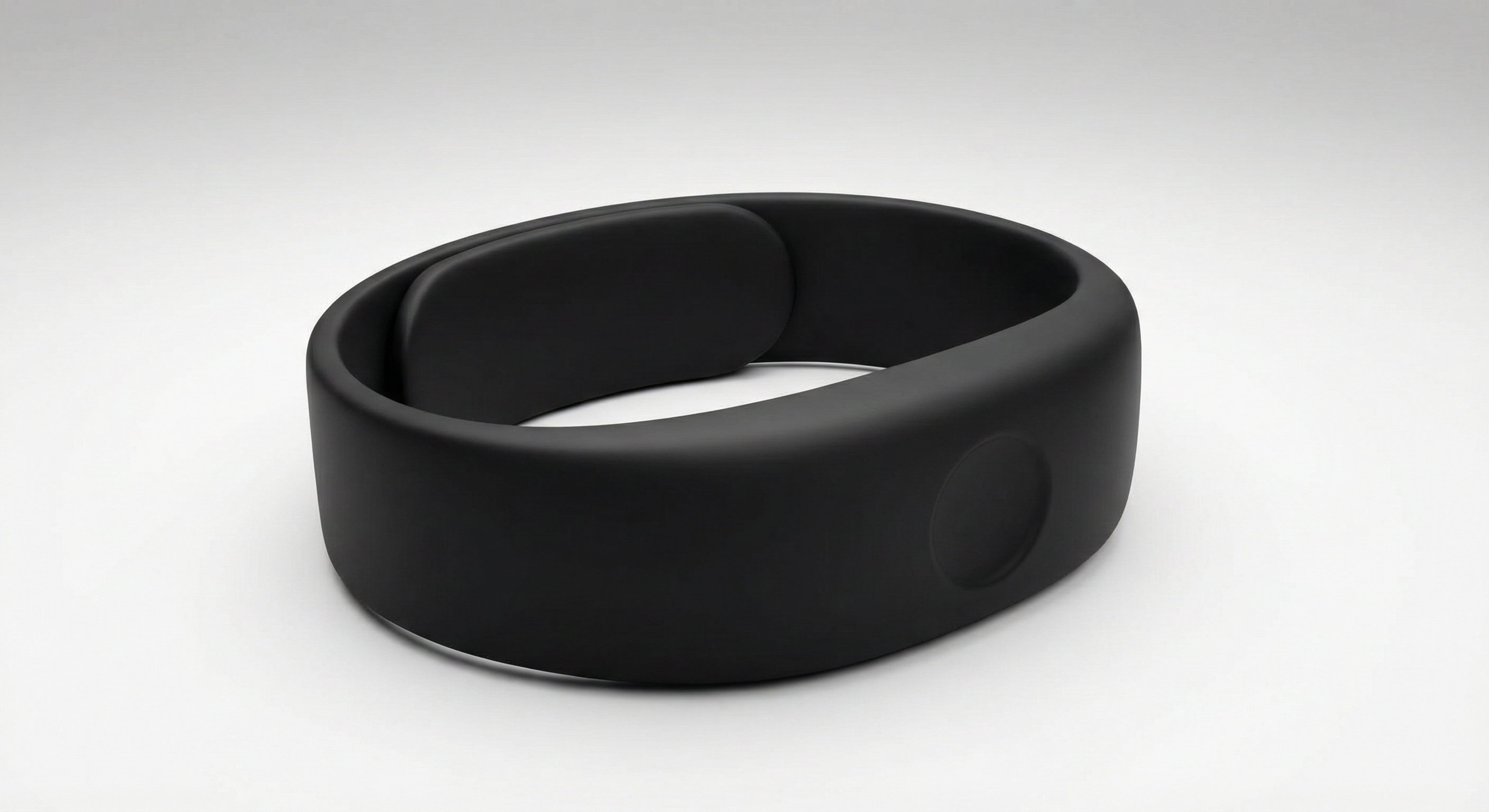 SafeBand — a simple, wide black wristband with no screen and a subtle panic button
